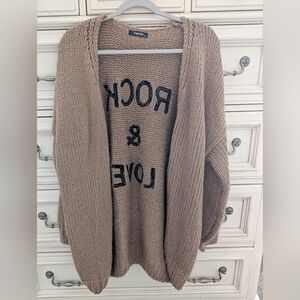 Tan Sweater with Black Text